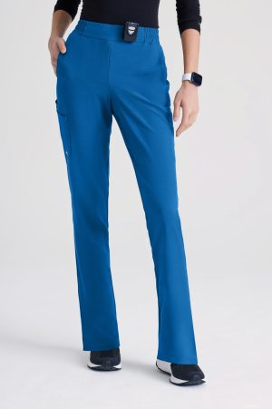 Grey's Anatomy Evolve 6 Pocket Tapered Leg Pant in Blue